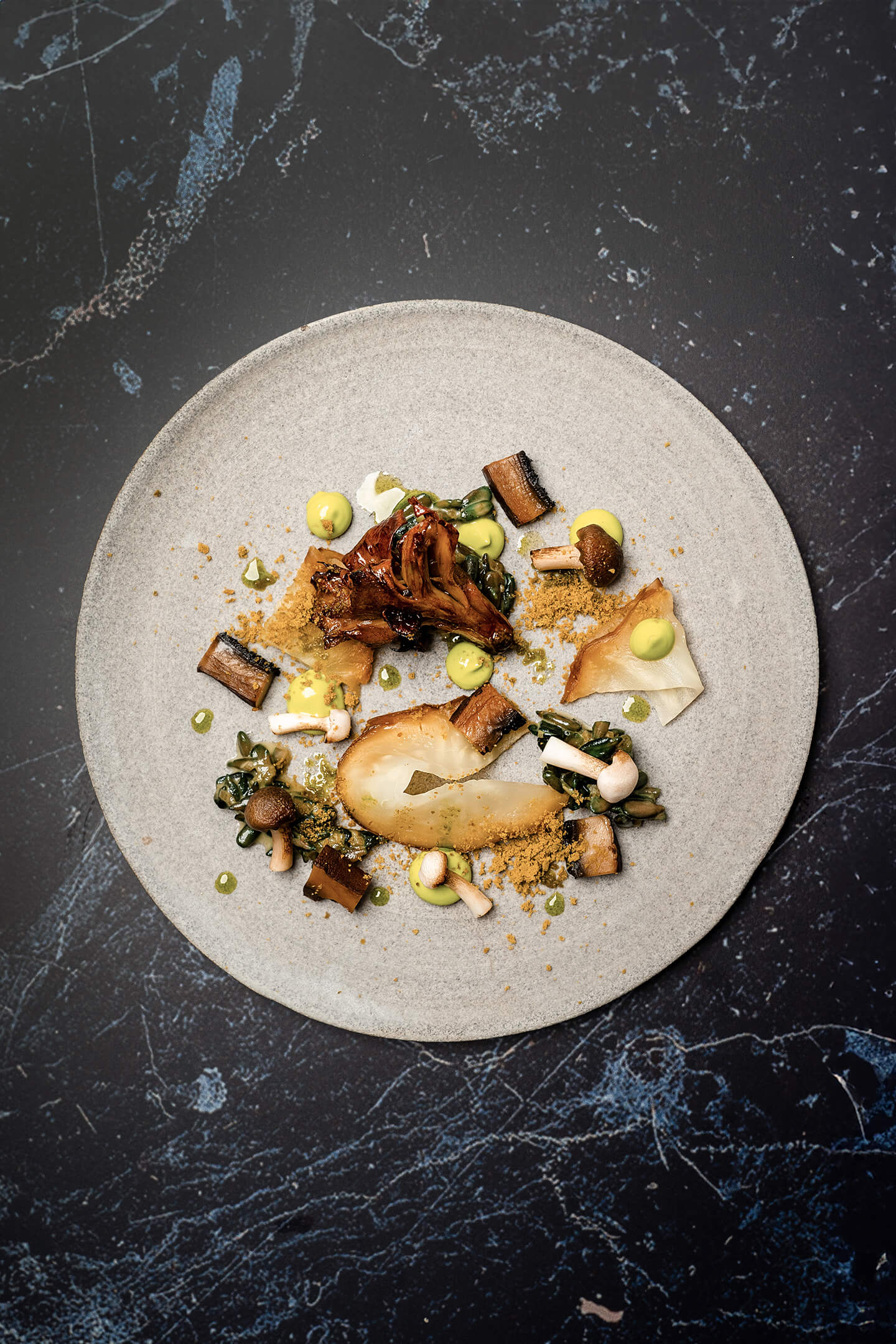 Celeriac bacon, hen-of-the-woods from the konro grill and risotto of oxidised sunflower seeds